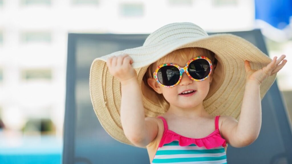 How should children be protected from the sun?